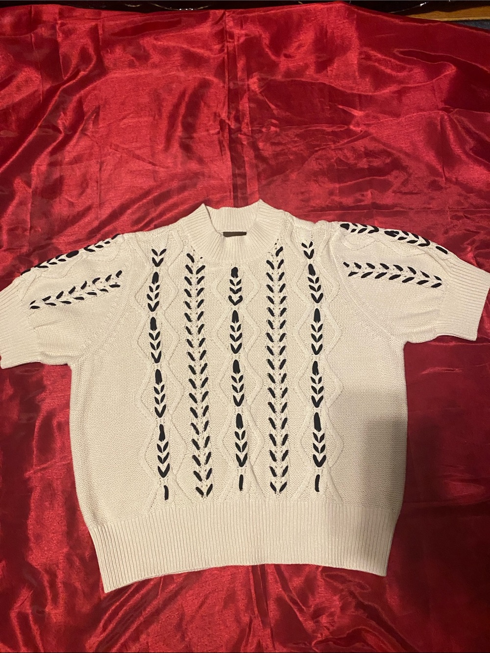 Classic Ivory Short-Sleeve Knit Sweater with Black Openwork Detail